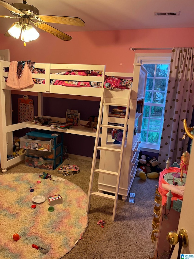 bedroom with ceiling fan and carpet flooring