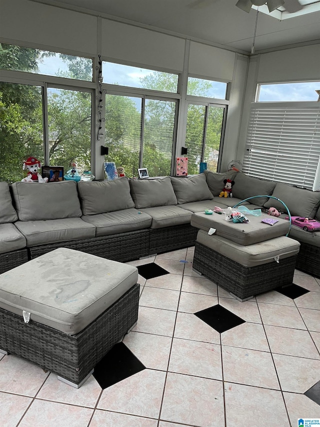 tiled living room featuring ceiling fan