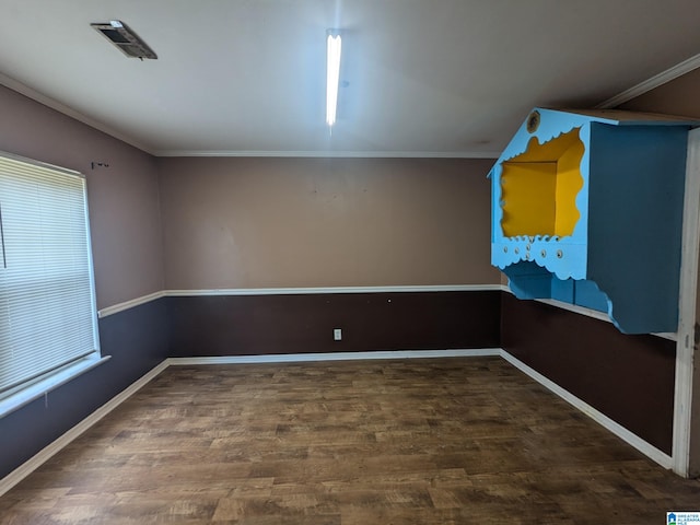 unfurnished room with crown molding and hardwood / wood-style flooring