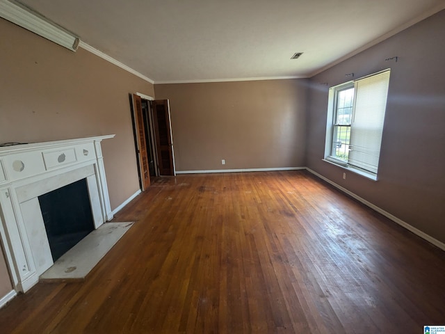 unfurnished living room with ornamental molding and dark hardwood / wood-style flooring