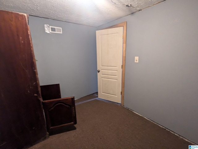 interior space featuring a textured ceiling