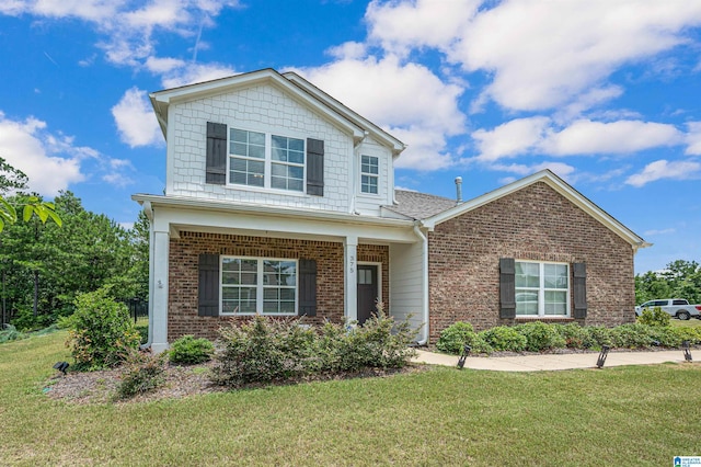 view of front of property with a front lawn and covered porch