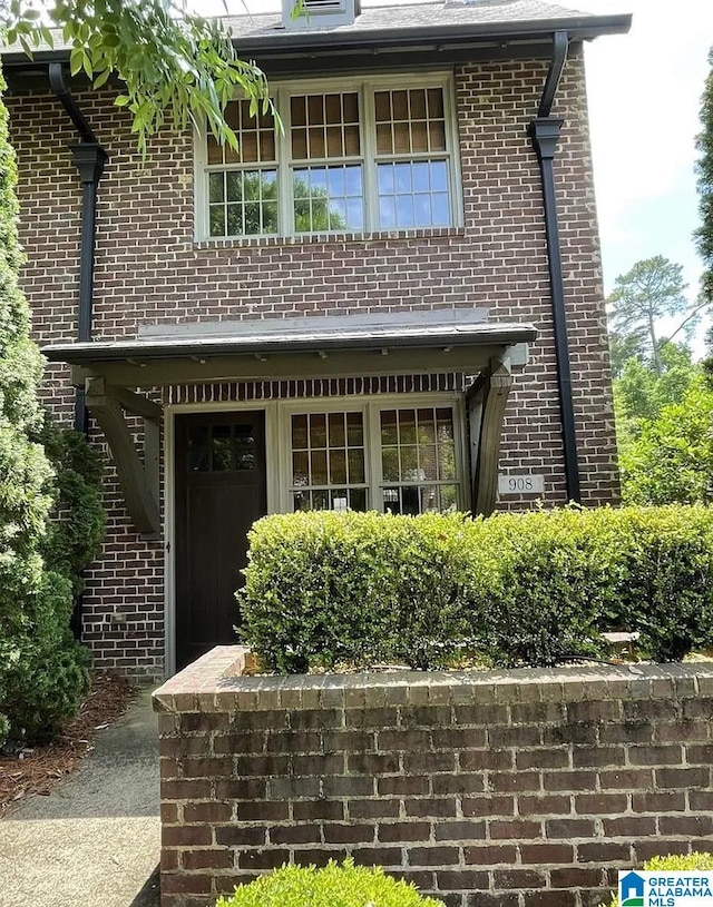 exterior space with brick siding