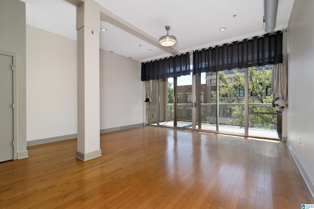 unfurnished room with light hardwood / wood-style floors