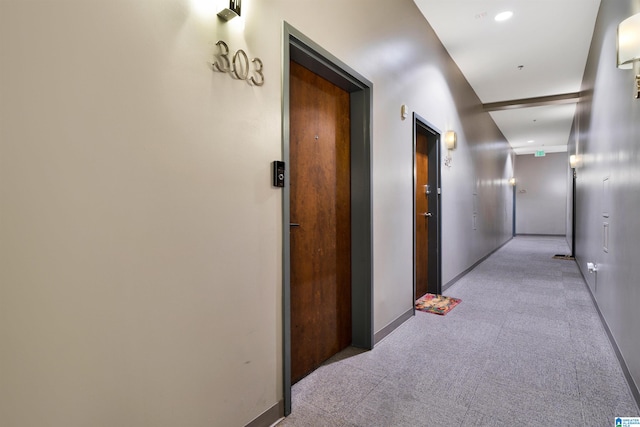 corridor with light colored carpet