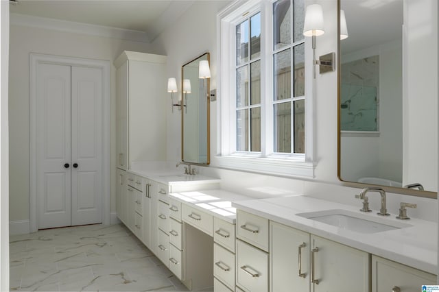 bathroom with double vanity, plenty of natural light, marble finish floor, and a sink