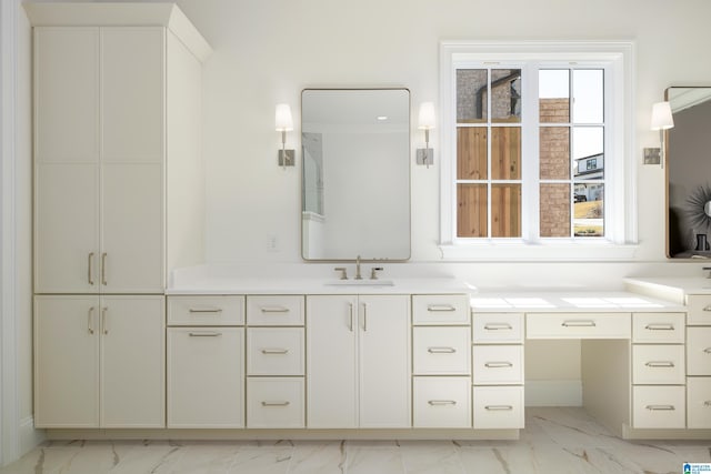 full bath with marble finish floor and vanity