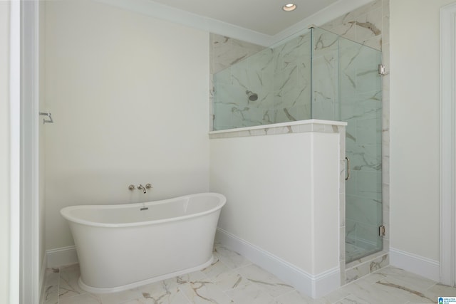 bathroom with a soaking tub, baseboards, marble finish floor, and a marble finish shower