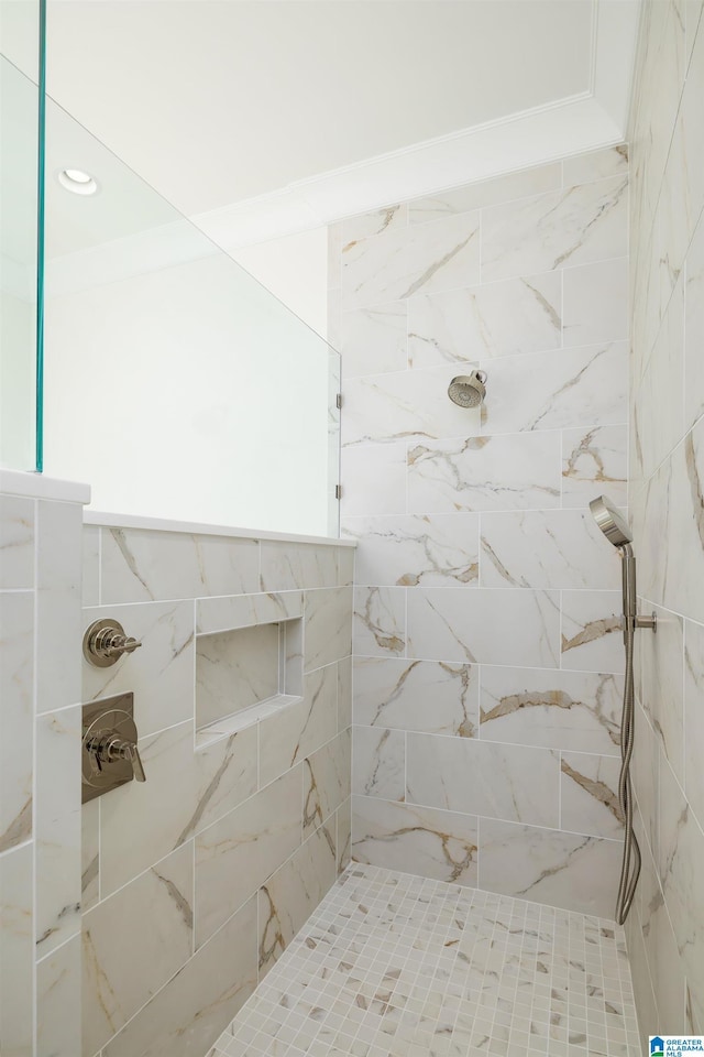 bathroom with tiled shower