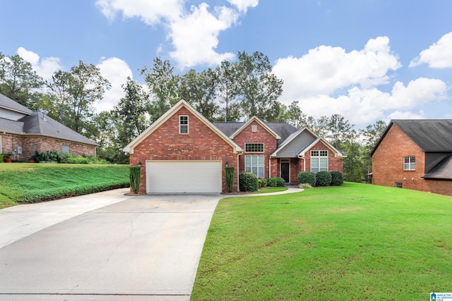 view of front of property with a garage and a front yard