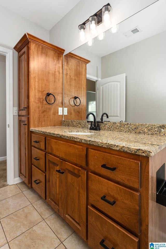 bathroom with vanity and tile patterned floors