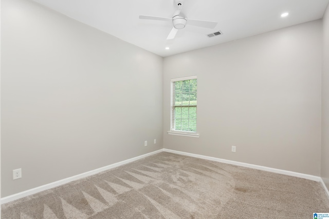 unfurnished room with carpet and ceiling fan