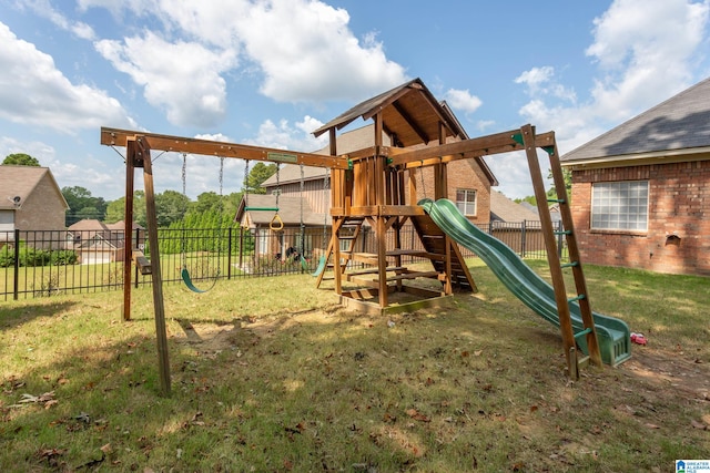 view of playground with a lawn