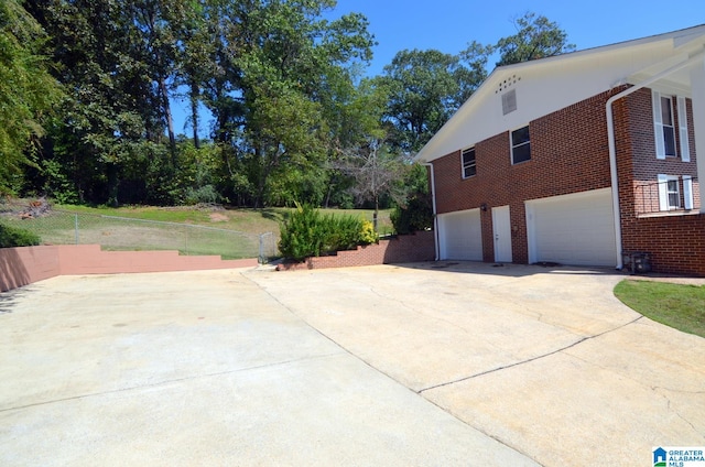 view of side of home featuring a garage