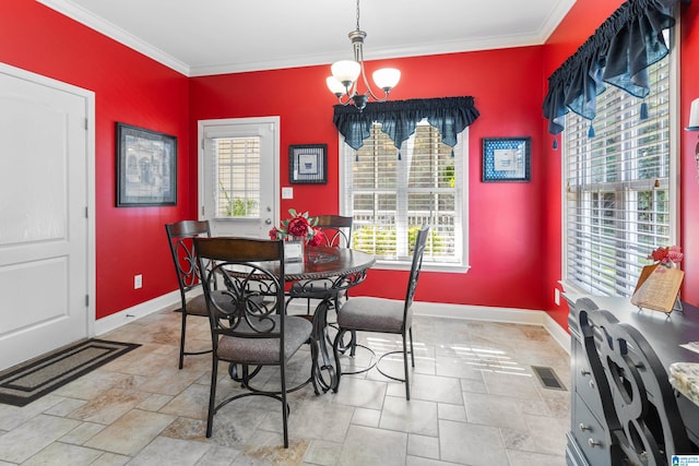 dining room with an inviting chandelier, ornamental molding, and a wealth of natural light