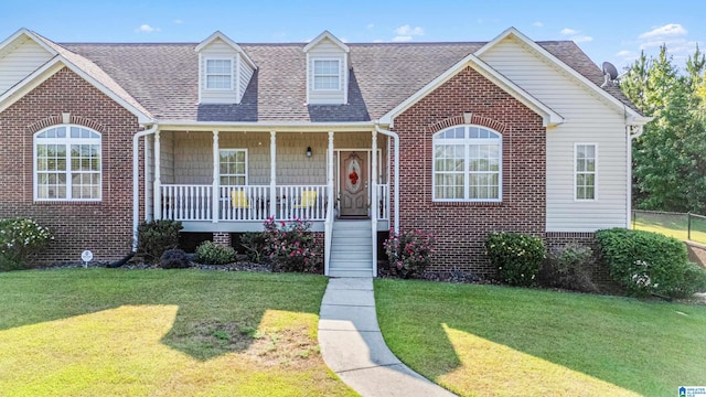 view of front of property with a porch and a front yard