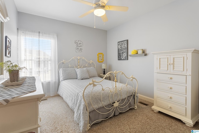 bedroom with ceiling fan and carpet flooring