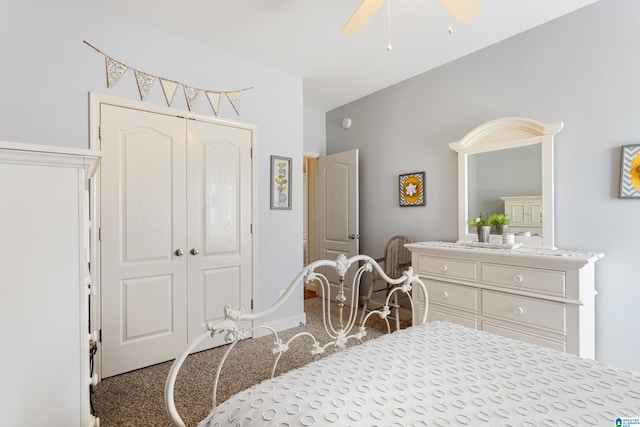 carpeted bedroom with ceiling fan and a closet