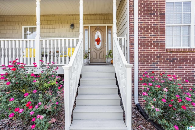 entrance to property featuring covered porch