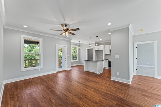 unfurnished living room with ornamental molding, dark hardwood / wood-style floors, and ceiling fan