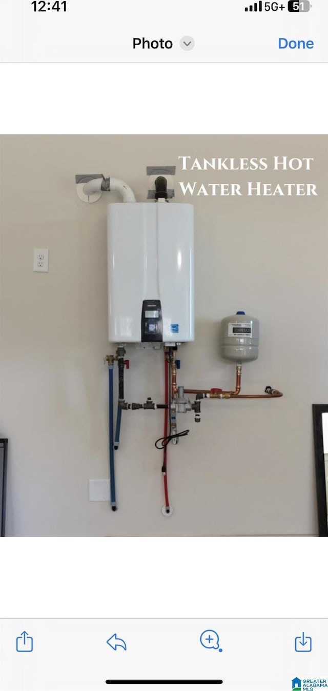 utility room with water heater