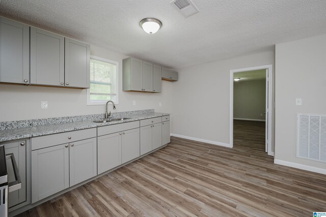 unfurnished bedroom featuring ornamental molding, a closet, and light hardwood / wood-style floors