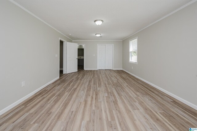 unfurnished bedroom featuring wood-type flooring, a textured ceiling, and a closet