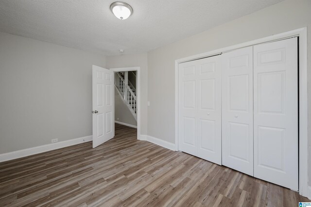 spacious closet with hardwood / wood-style flooring