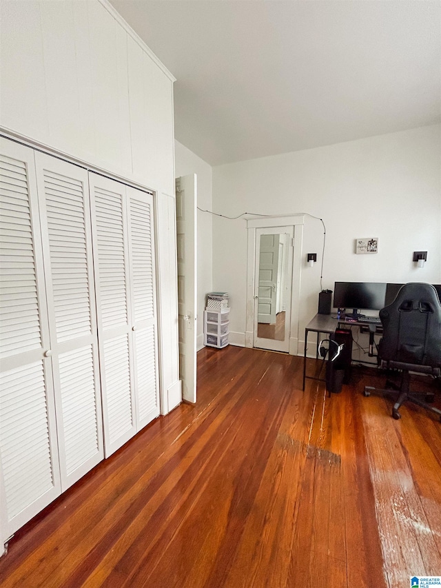 office with dark hardwood / wood-style flooring