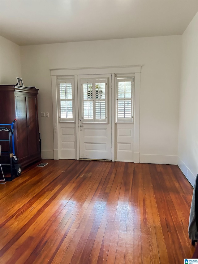 interior space with dark wood-type flooring