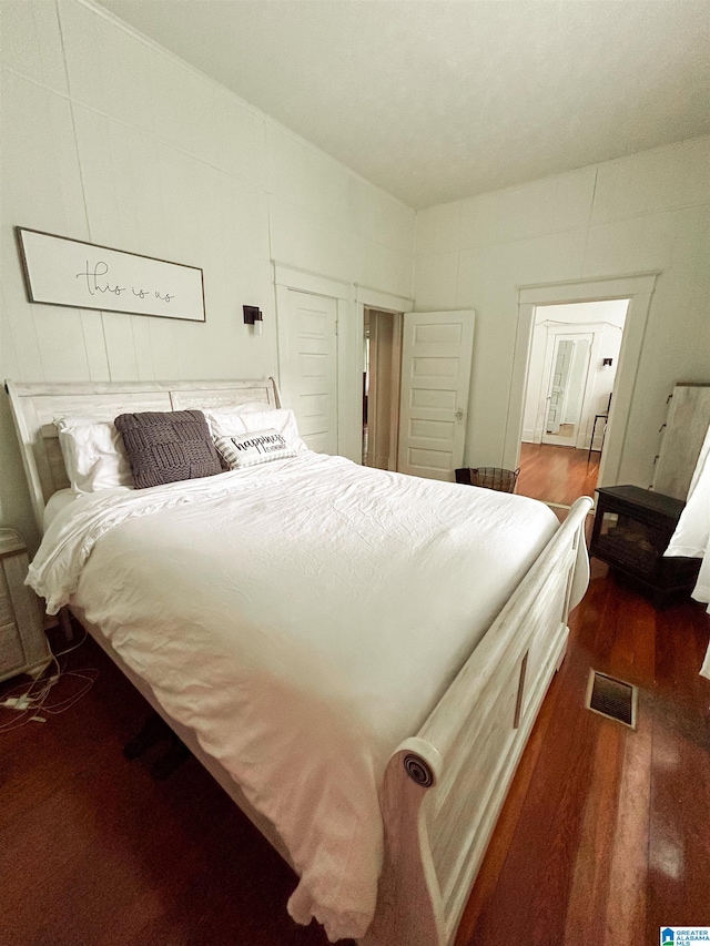 bedroom featuring dark hardwood / wood-style flooring