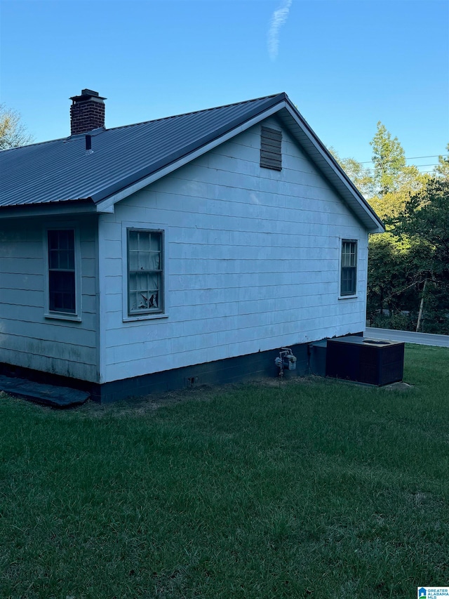 view of home's exterior featuring a yard