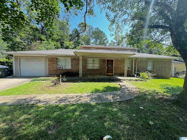 single story home featuring a garage and a front lawn