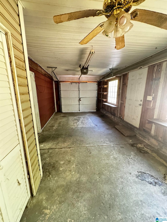 garage with ceiling fan and a garage door opener