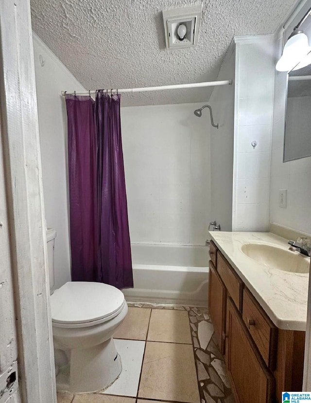 full bathroom featuring vanity, shower / bath combination with curtain, a textured ceiling, toilet, and tile patterned floors