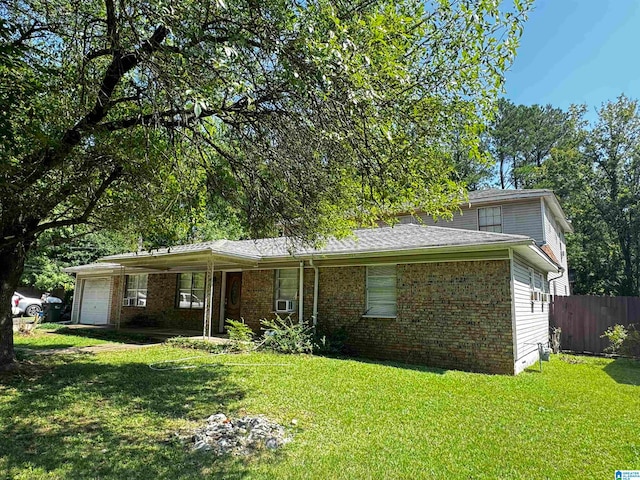 view of front of property with a garage and a front yard