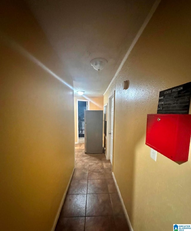 corridor featuring tile patterned flooring