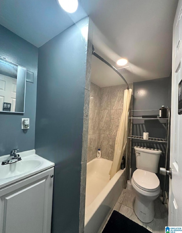 full bathroom featuring vanity, tile patterned floors, shower / tub combo, and toilet