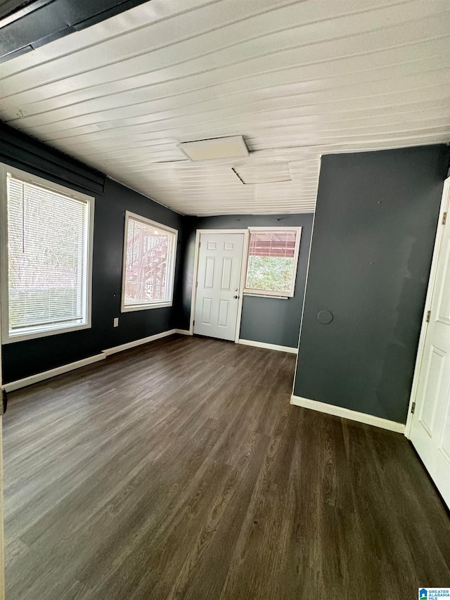 unfurnished bedroom with dark hardwood / wood-style floors