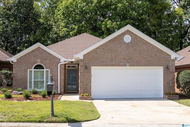 view of front of home featuring a garage and a front lawn