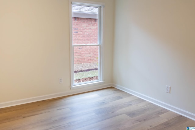 unfurnished room with light hardwood / wood-style floors