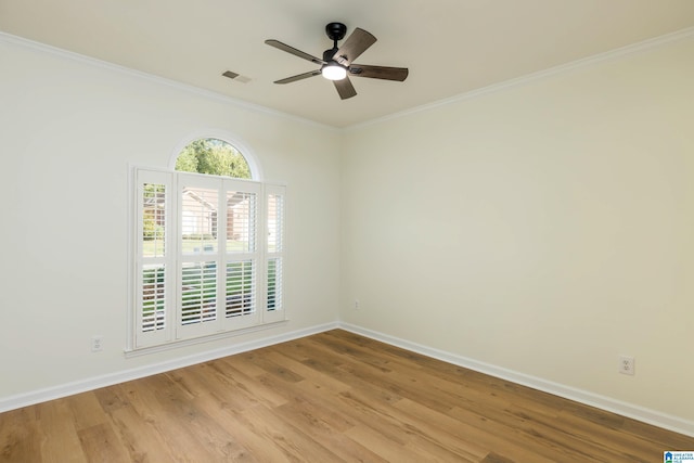 spare room featuring light wood-type flooring, ceiling fan, and crown molding