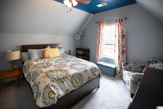 carpeted bedroom featuring lofted ceiling and ceiling fan