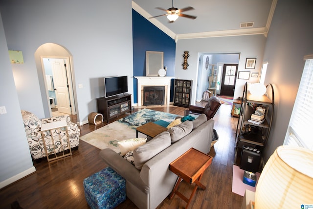 living room with high vaulted ceiling, dark hardwood / wood-style floors, ceiling fan, and plenty of natural light