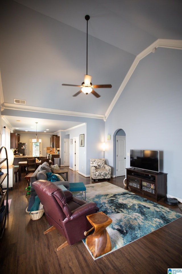 living room featuring ornamental molding, ceiling fan, high vaulted ceiling, and dark wood-type flooring