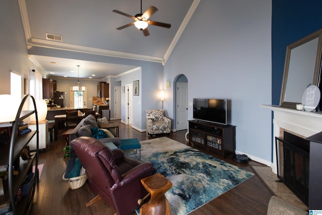 living room with ornamental molding, ceiling fan, high vaulted ceiling, and dark hardwood / wood-style flooring