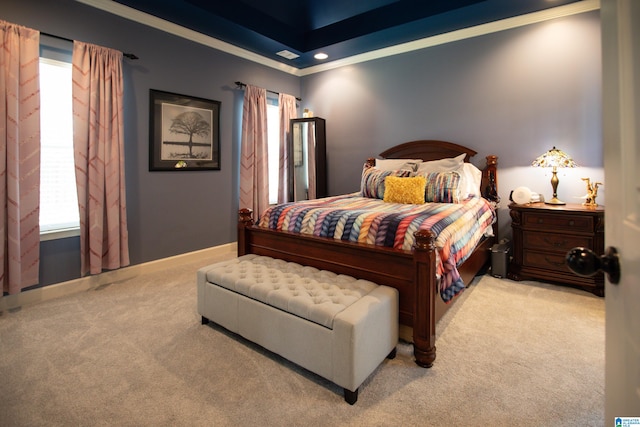 carpeted bedroom with ornamental molding