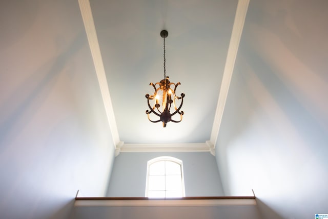 interior details with an inviting chandelier and crown molding