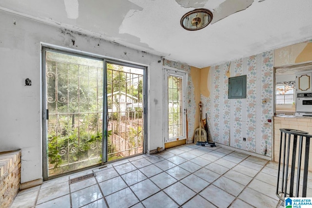 interior space with light tile patterned floors and a healthy amount of sunlight