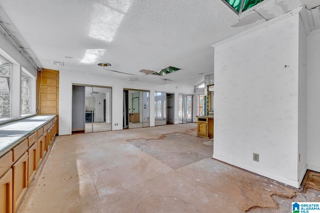 interior space with a textured ceiling